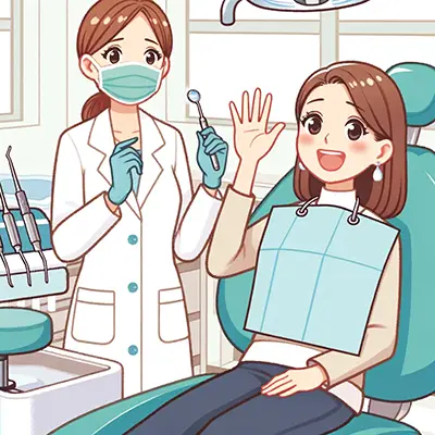 手をあげて歯科医師に痛みを伝える女性
